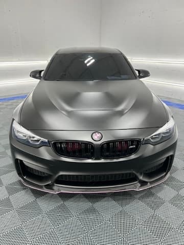 Matte grey BMW M4 Competition after a full detail at our Oakland Park shop
