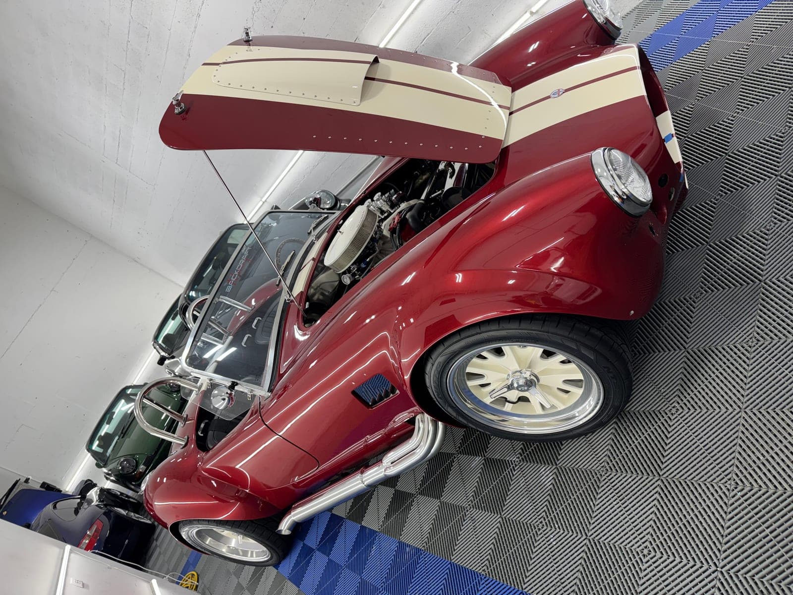 Classic maroon convertible after a full exterior detail