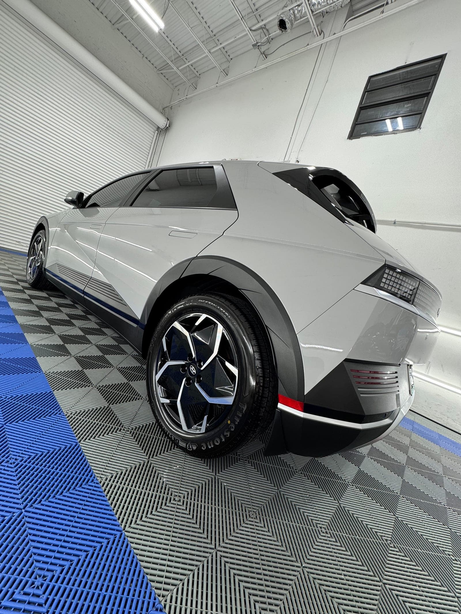 Silver C8 Corvette rear-three-quarter after a complete exterior detail