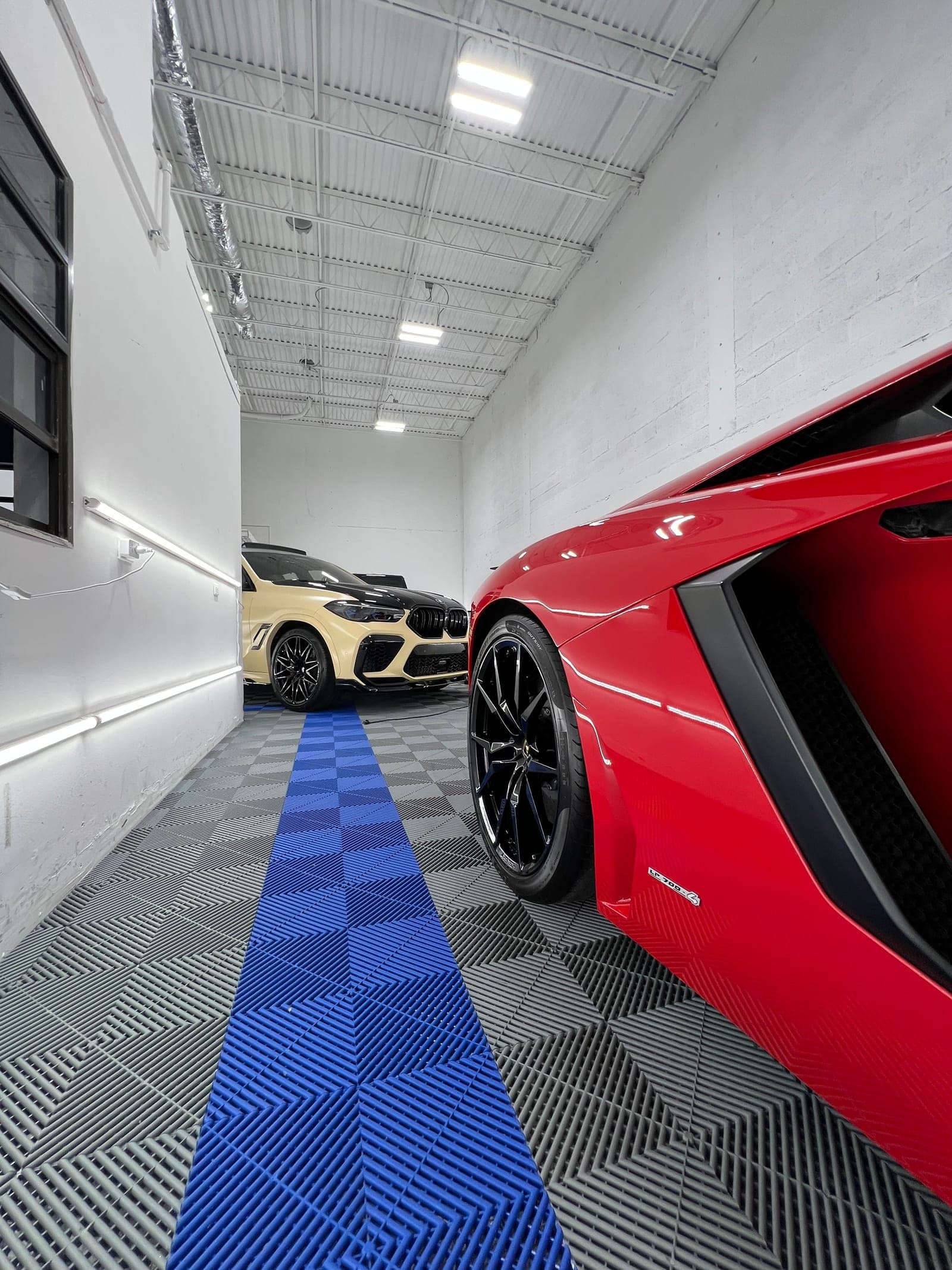Ferrari wheel-face detail — meticulous cleaning between every spoke