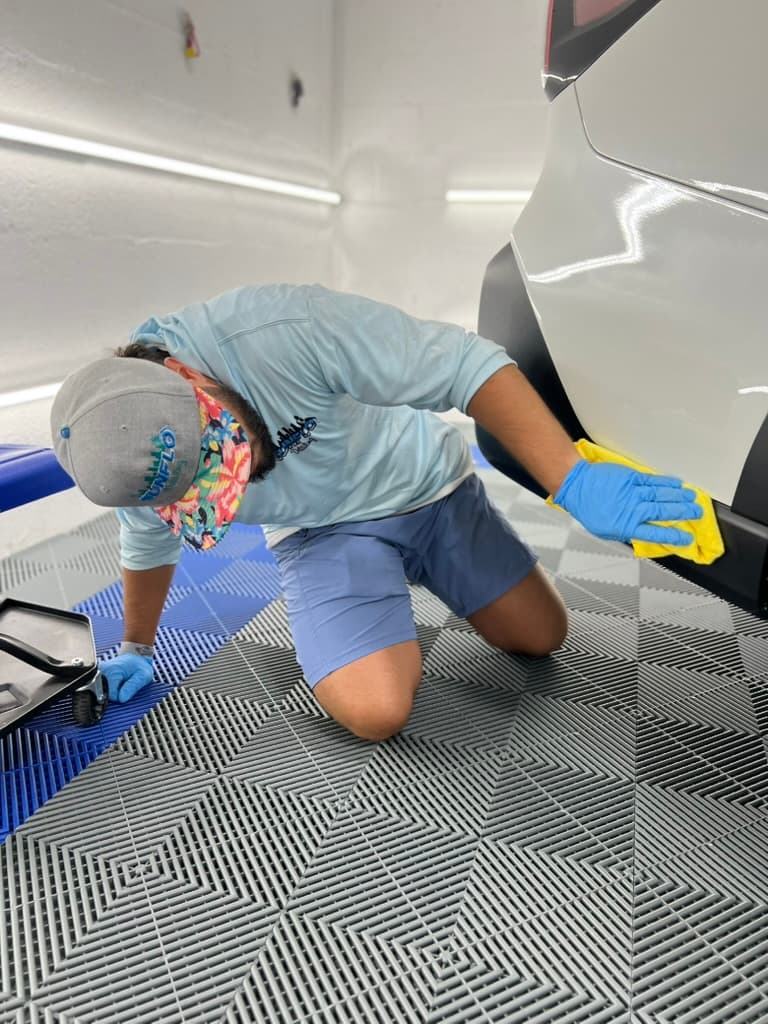 Sunflo tech putting the finishing touches on a panel — no shortcuts