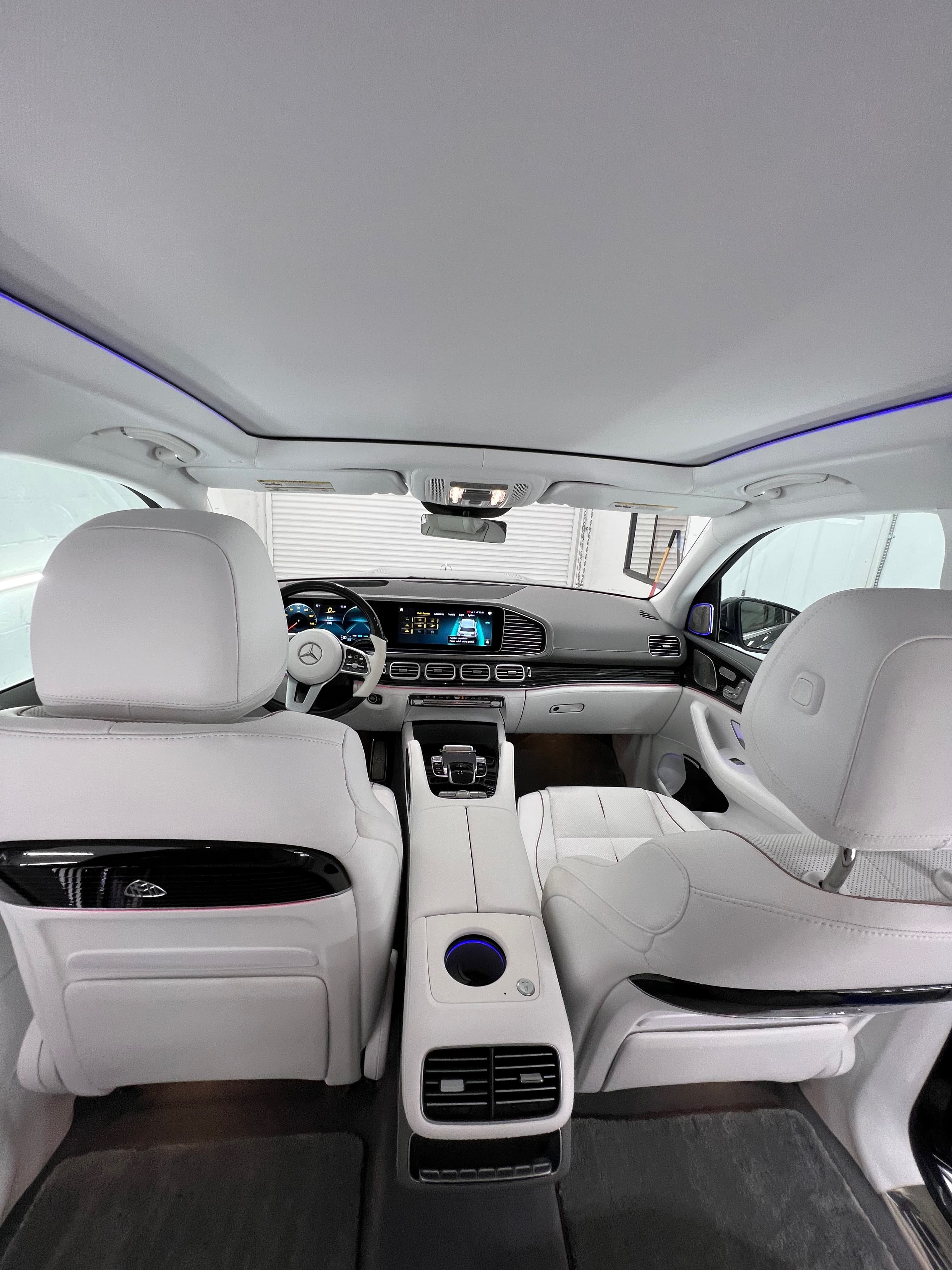 Mercedes-Maybach GLS rear cabin — first-class white leather seating after a full interior detail